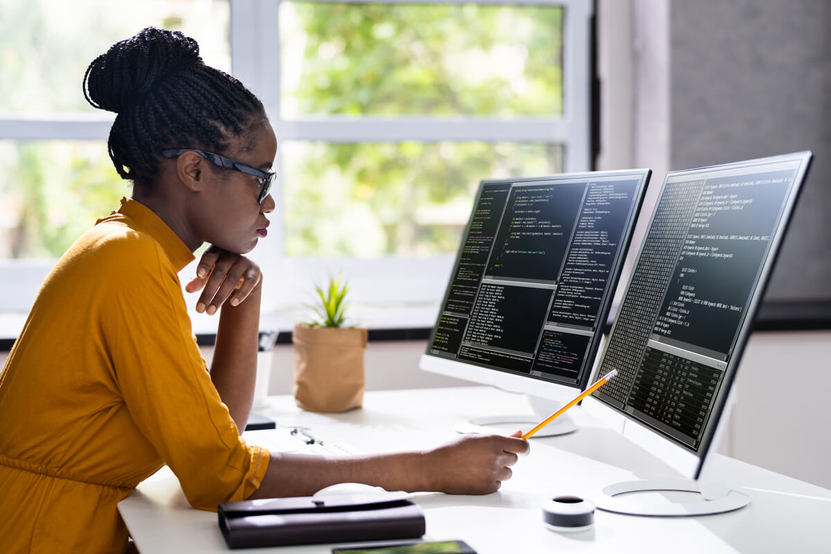 African American Woman Programmer. Girl Coding On Computer
