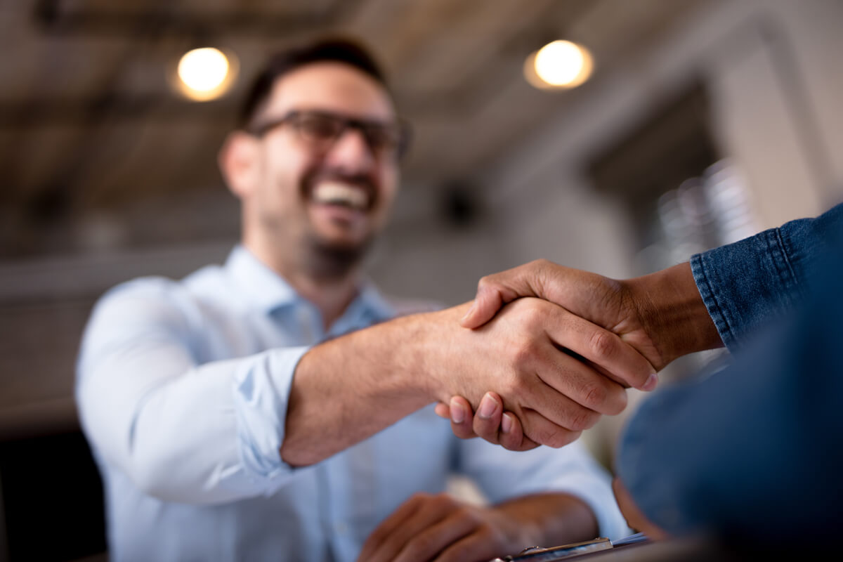 Business people shaking hands.